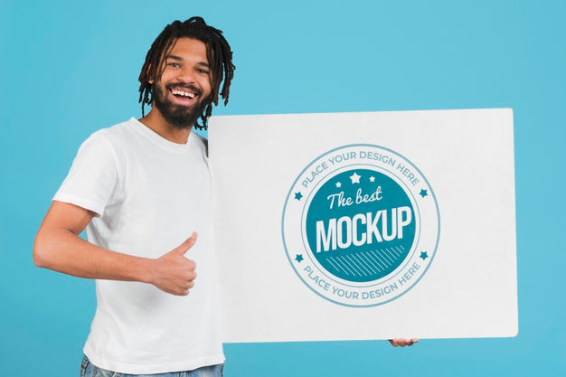Man Holding Poster Mockup Psd
