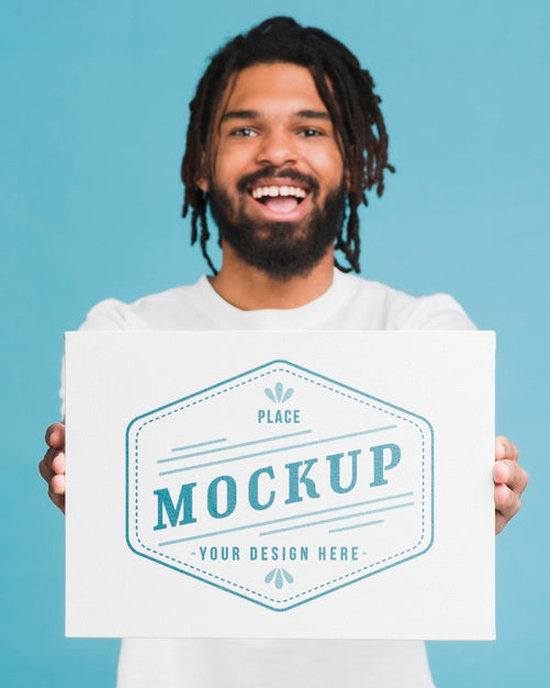 Man Holding Poster Mockup Psd