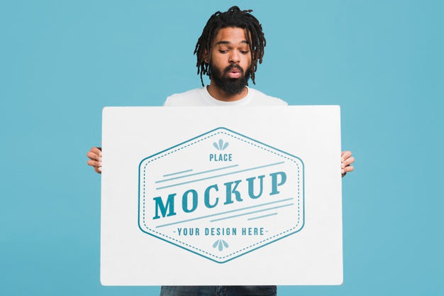 Man Holding Poster Mockup Psd