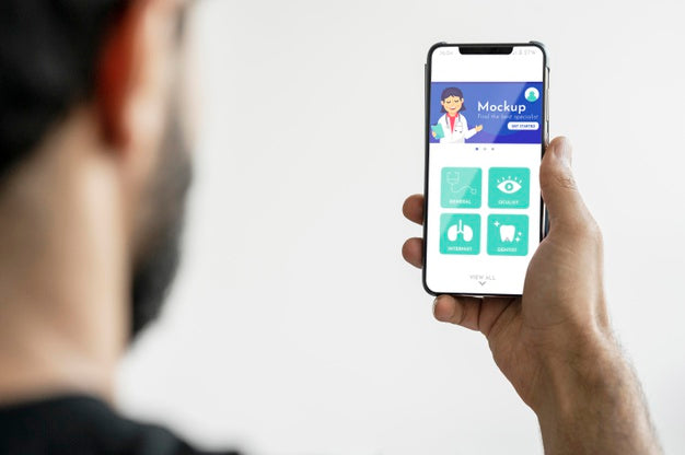 Man Holding Smartphone Close-Up Psd