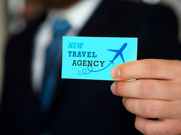 Man Holding Up A Business Card Mock-Up Psd