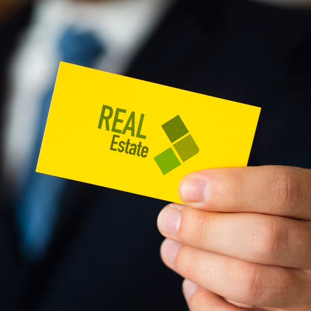 Man Holding Up A Business Card Psd