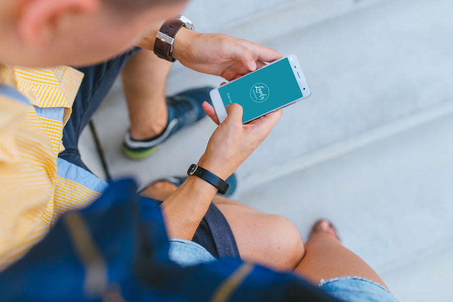 Man Holding Xiaomi Mi5 in His Hands PSD Mockups