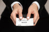 Man In Suit Holding A Business Card Psd