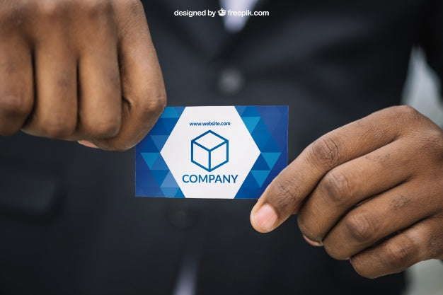 Man In Suit Holding Business Card Mockup Psd