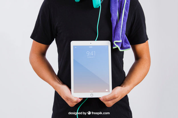 Man In Summer Wear Showing Tablet Psd