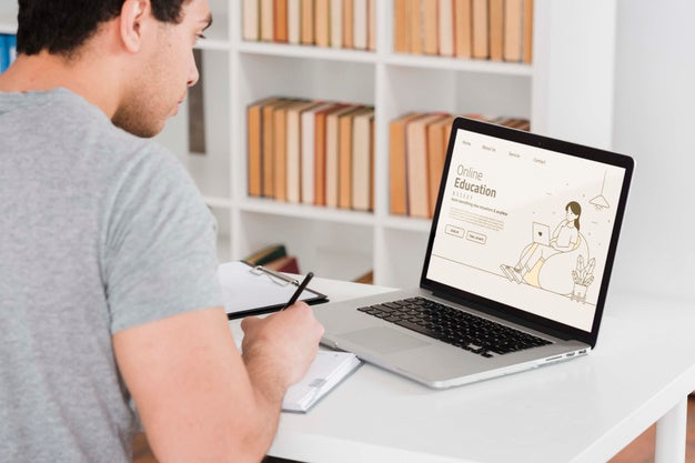 Man Learning Online With Laptop Psd