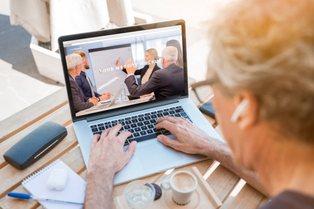 Man Looking At Laptop Mockup Psd