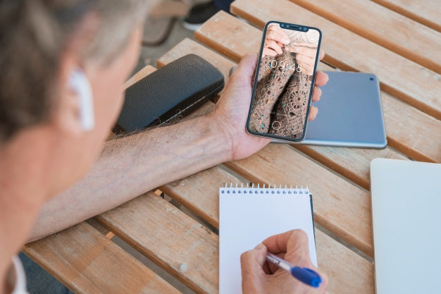Man Looking At Smartphone Mockup Psd