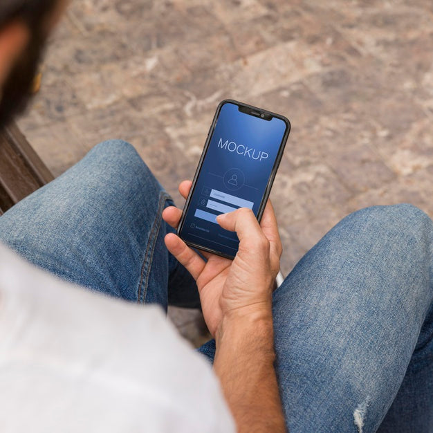 Man On Street With Phone Using App Psd