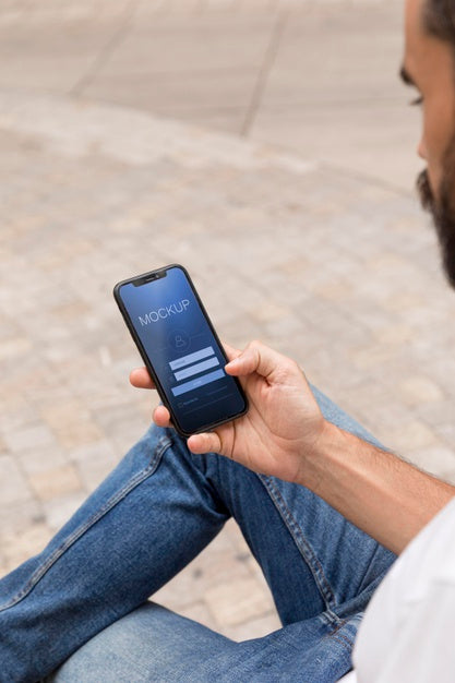 Man On Street With Phone Using App Psd