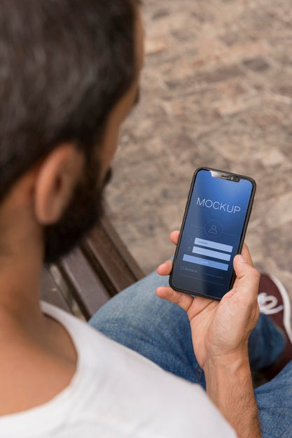 Man On Street With Phone Using App Psd