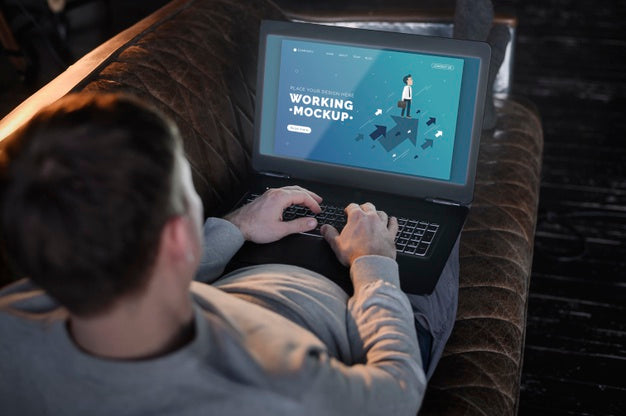 Man On The Couch Working From Home On Laptop Psd