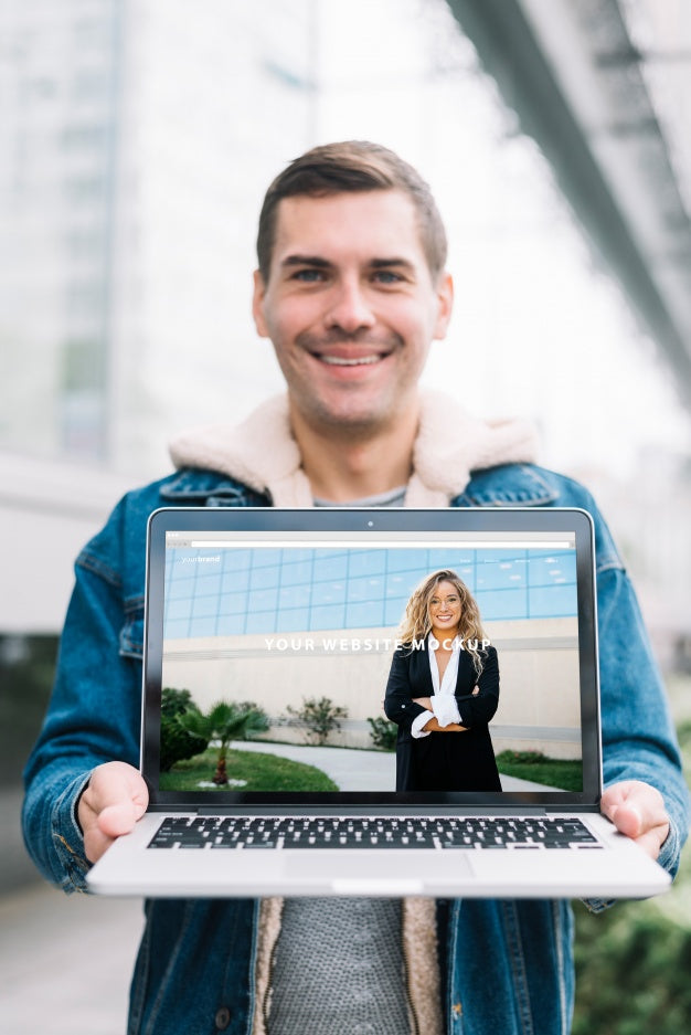 Man Presenting Laptop Mockup Psd