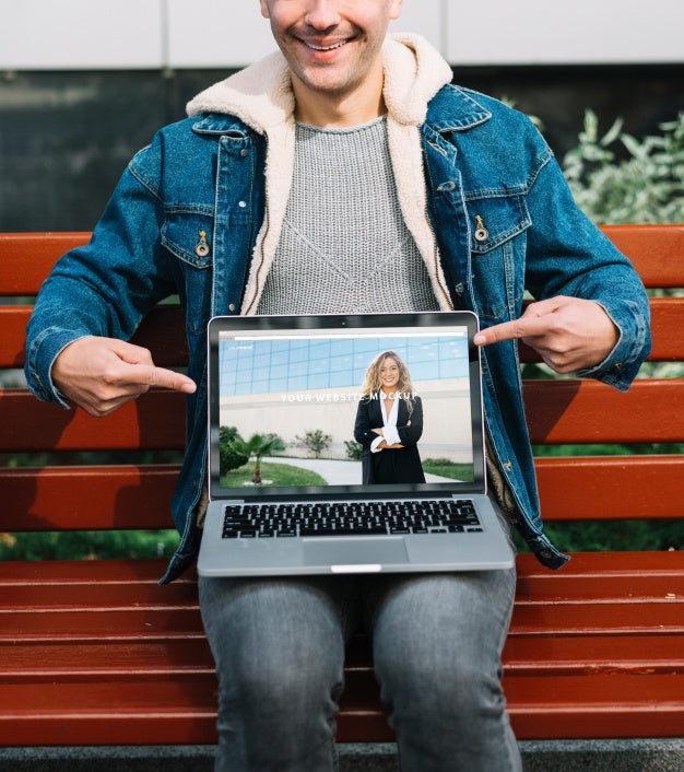 Man Presenting Laptop Mockup Psd