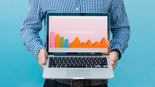 Man Presenting Laptop Mockup Psd