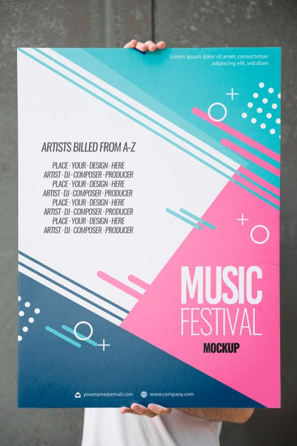 Man Presenting Poster Mockup In Front Of Wall Psd