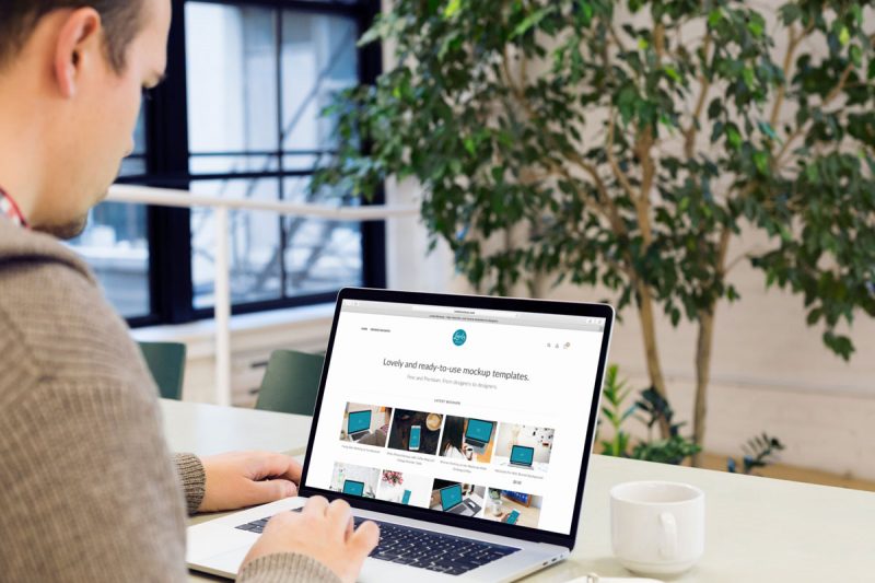 Man Working on a Macbook pro Mockup