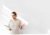 Man Reading In Front Of White Wall Psd