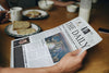 Man Reading The News At The Breakfast Table Psd