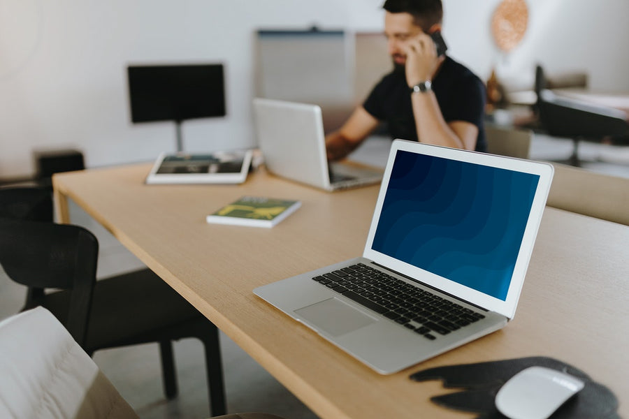 Man Talking On A Phone In A Meeting Room