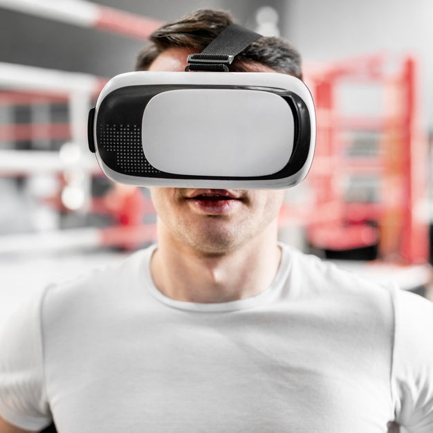 Man Using Virtual Reality Goggles At Boxing Training Psd