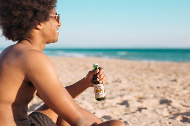 Man With Beer Bottle Mockup At The Beach Psd