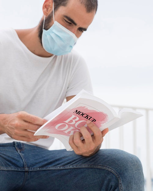 Man With Mask On Street Reading Book Psd