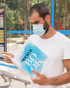 Man With Mask On Street Reading Book Psd