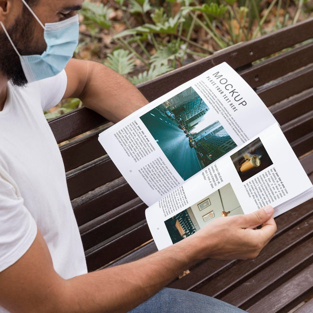 Man With Mask On Street Reading Book Psd