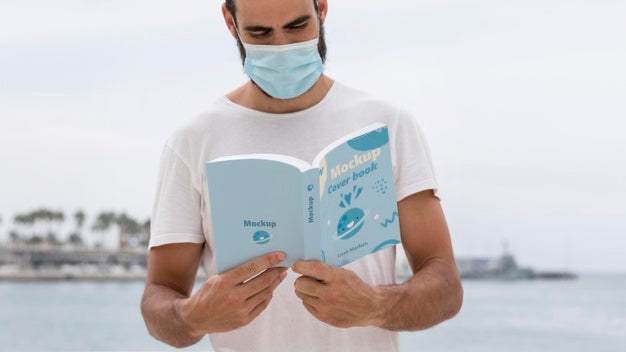 Man With Mask On Street Reading Book Psd