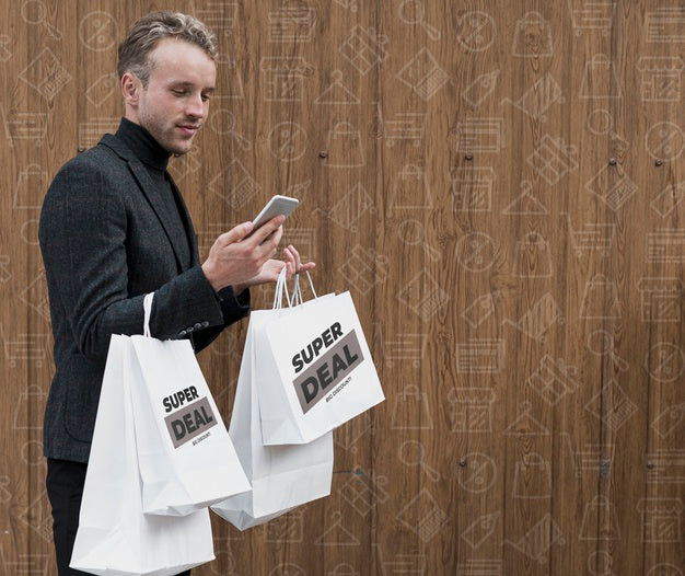Man With Shopping Bags Checking Phone Psd