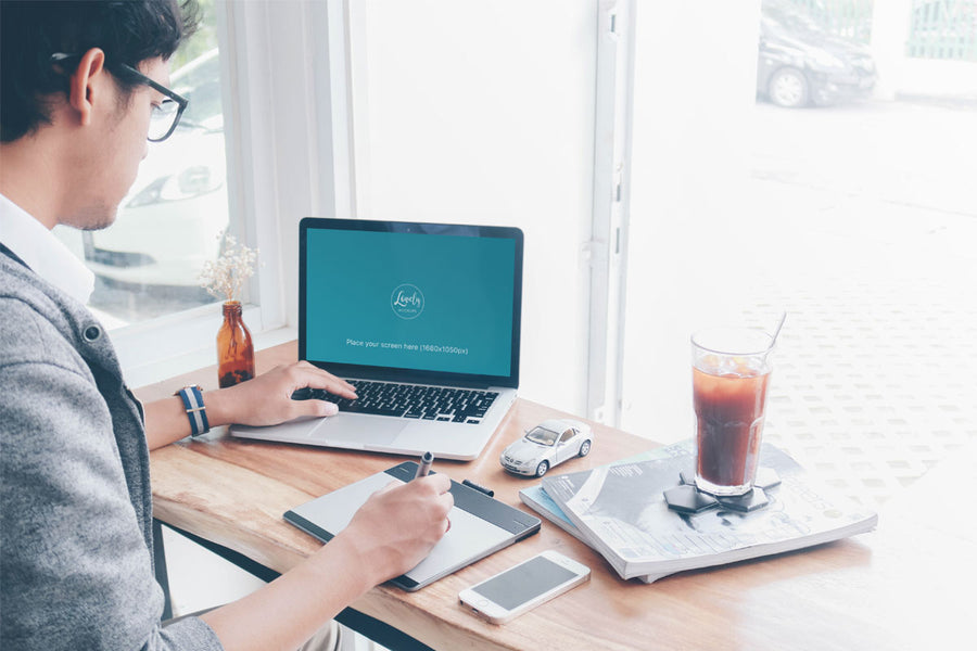 Man Working on a Macbook Pro Mockup