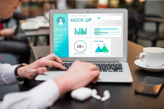 Man Working On Laptop At A Cafe Psd