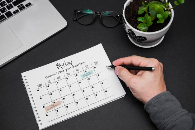 Man'S Hand Writing On Calendar Psd