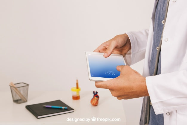 Medical Mock Up With Doctor Working With Tablet Psd
