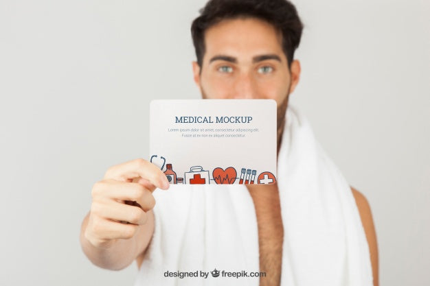 Medical Mock Up With Young Man Holding Card Psd