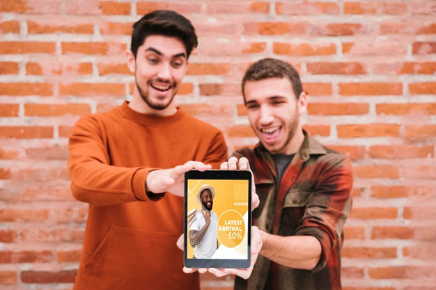Medium Shot Happy Guys Holding Up Tablet Psd