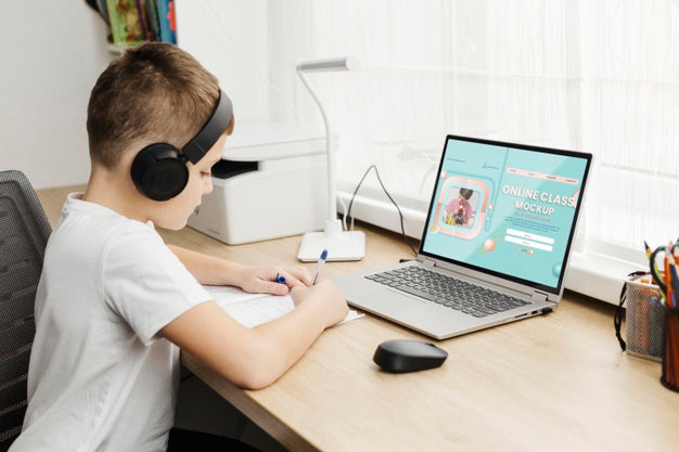 Medium Shot Kid With Laptop Psd
