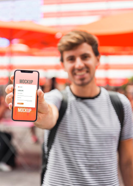 Medium Shot Man Holding Smartphone Psd