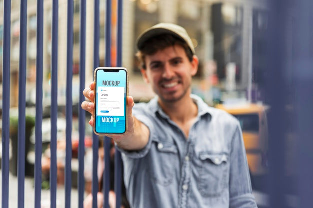 Medium Shot Man Holding Smartphone Psd