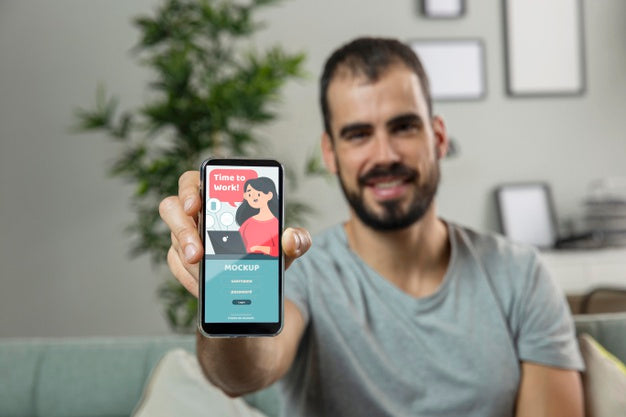 Medium Shot Man Holding Smartphone Psd