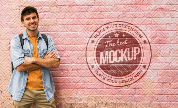 Medium Shot Man Posing Near Wall Psd