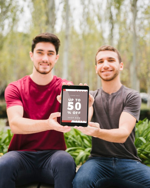 Medium Shot Sitting Boys With Tablet Psd