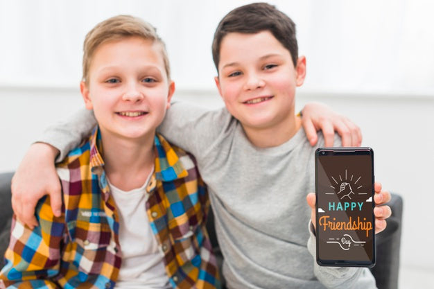 Medium Shot Smiley Boys With Smartphone Psd