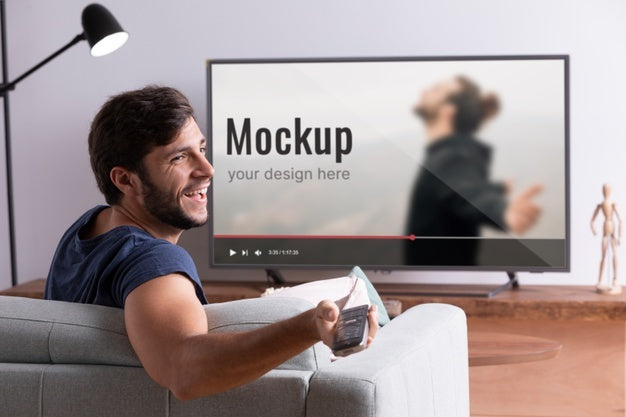 Medium Shot Smiley Man Watching Movie On Tv Psd