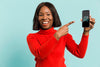 Medium Shot Smiley Woman Holding A Smartphone Psd