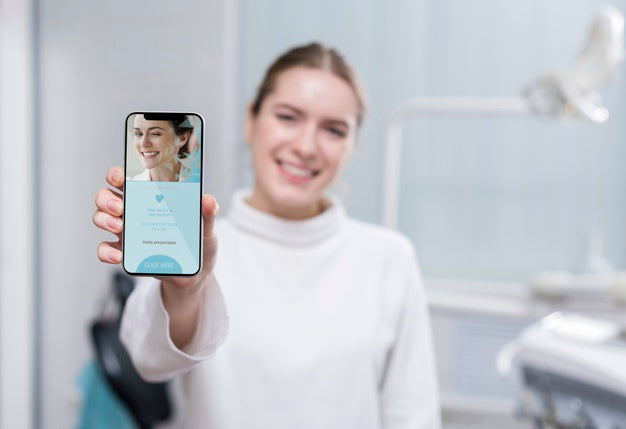 Medium Shot Woman Holding A Smartphone Psd