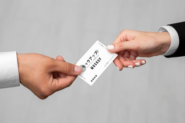 Men Holding A Business Card Mock-Up Psd