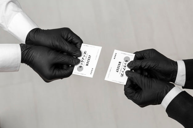 Men With Gloves Holding Business Cards Mock-Up Psd
